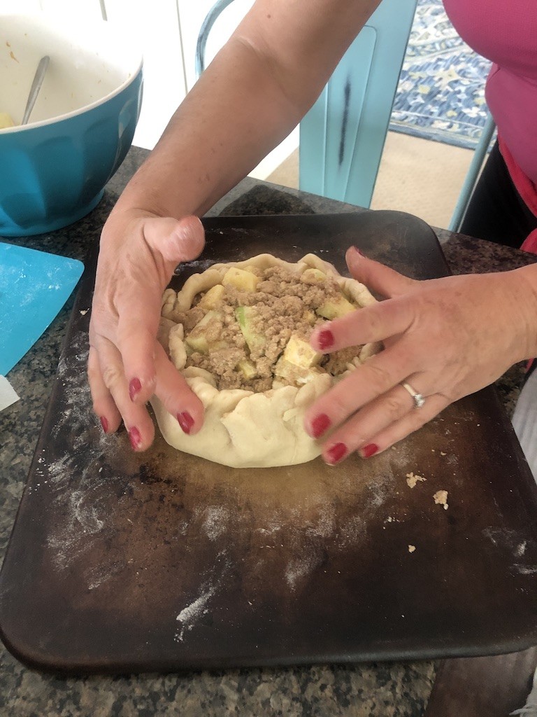 gather up edges of pie dough 