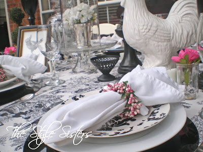 Black and white tablescape white napkins white rooster pink berry napkin rings