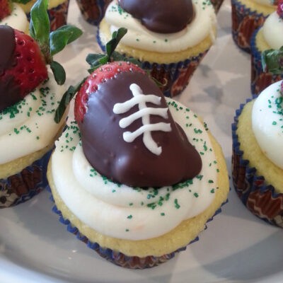 Chocolate dipped strawberry football cupcakes