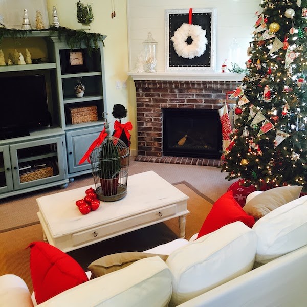 Traditional Christmas family room with fluffy wreath over fireplace