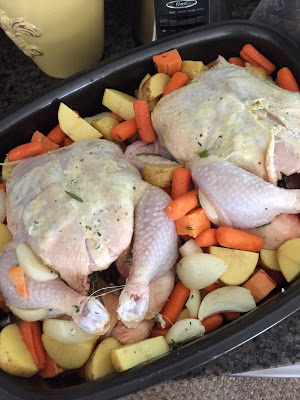 Two roasted her butter chickens, roasted vegetables, Sunday dinner with the family