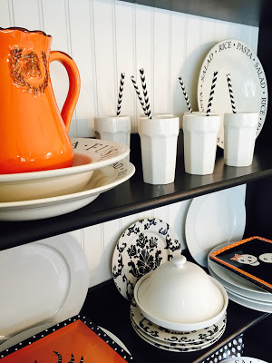 Black and white shelving with pops of orange for fall- Karins Kottage