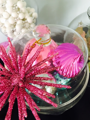 Pink ornaments in apothecary jars