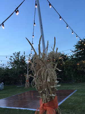 Corn stalks cover PVC Pipes for wedding reception. outdoor wedding reception decoration ideas