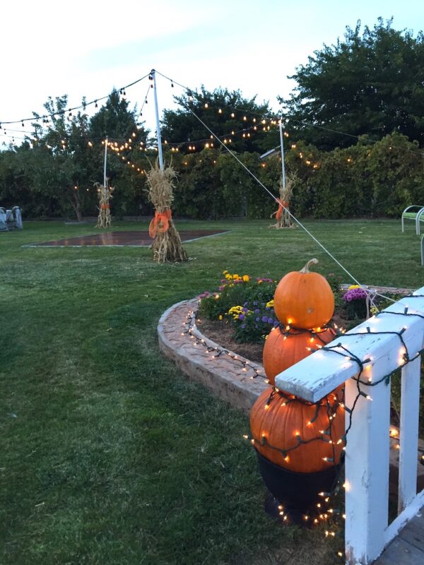 easy rustic outdoor wedding with pumpkin topiary