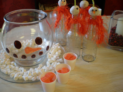 Snowman punch bowl with donut topped bottles