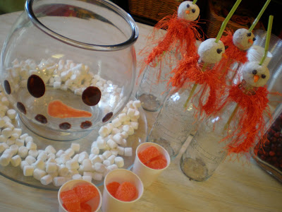Snowman punch bowl with donut topped bottles