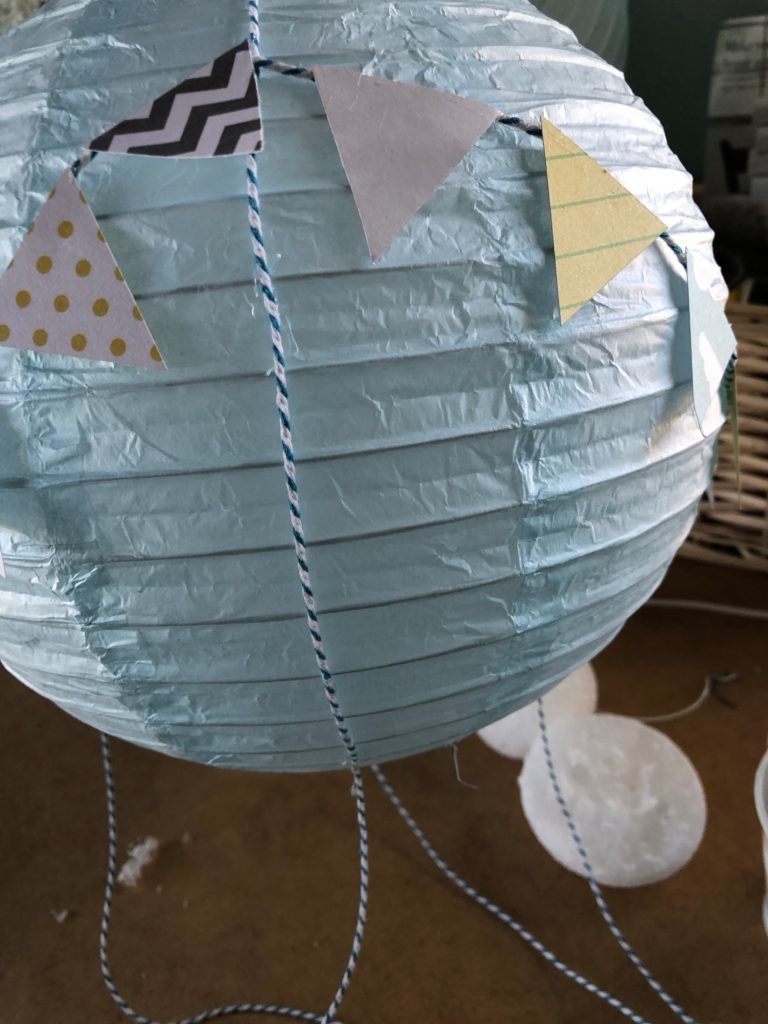 paper lantern turned into hot air balloon for baby shower
