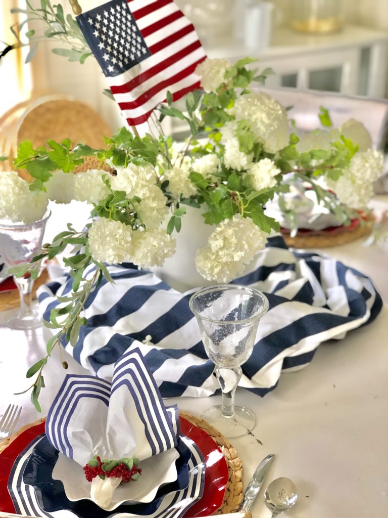 Memorial Day BBQ decorations food ideas and printable inviation, red white and blue tablescape, red white and blue with ruffled plates, white snowball flowers, 