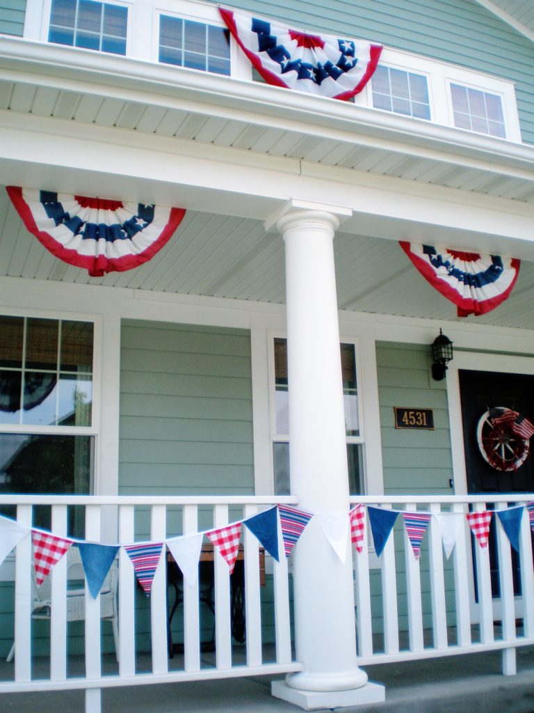  lake cottage decorated with red white and blue banners and American flags