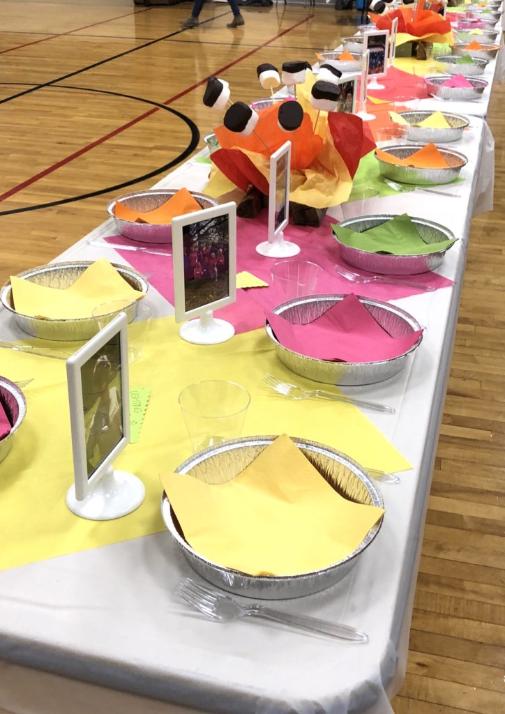 bright colored tissue paper lining the table creates a pretty table runner