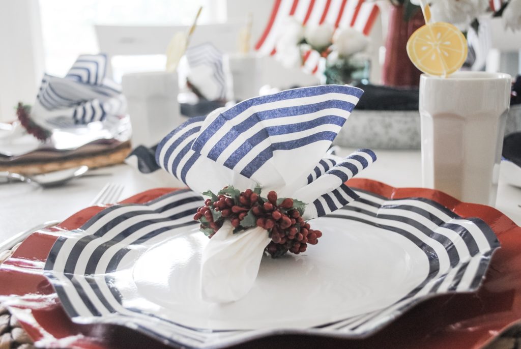 white and navy striped ruffled paper plates and red ruffle edged chargers