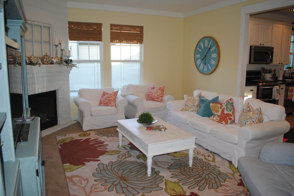 Light and airy family room with pastel colored pillows