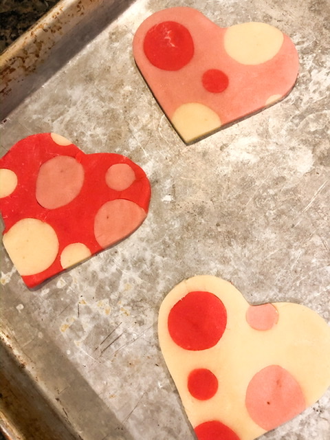 heart shaped polka dot valentine cookies. pink, red and white polka dots