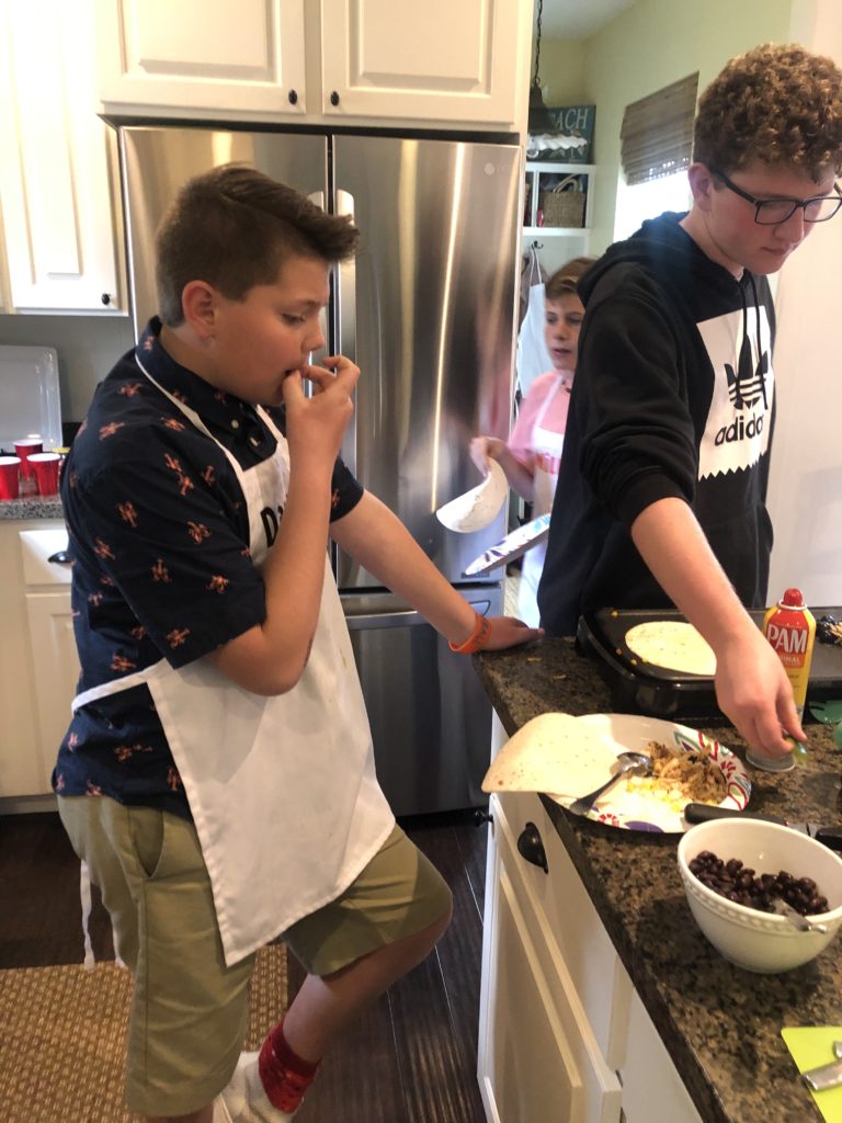 kids cooking in the kitchen making chicken tacos