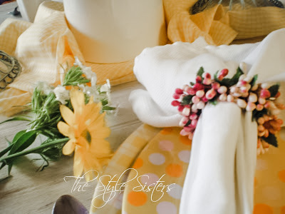 yellow pink and white polka dot plates and pink napkin rings for Mothers day