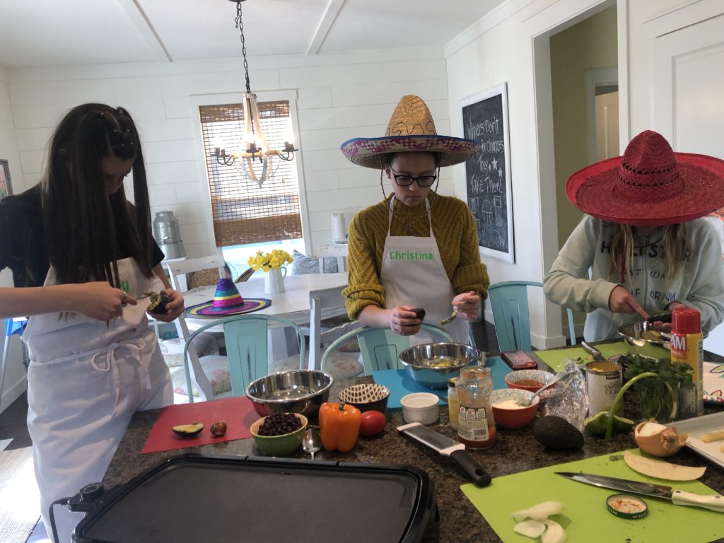 Using knife skills at kids cooking class