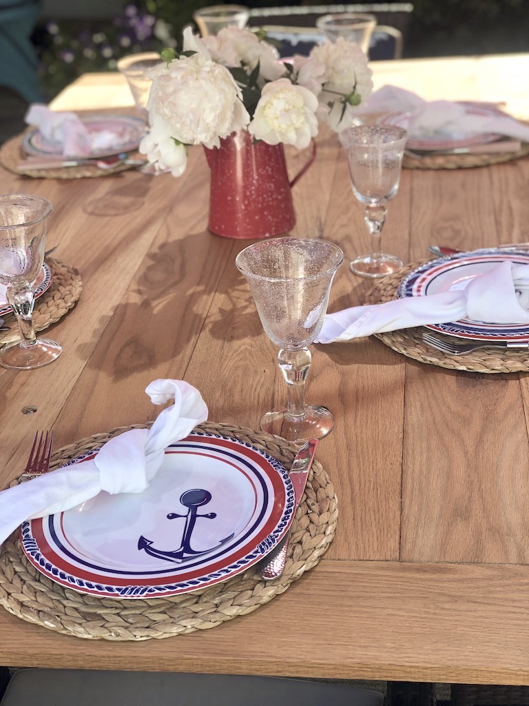 red white blue anchor melamine dishes on planked table