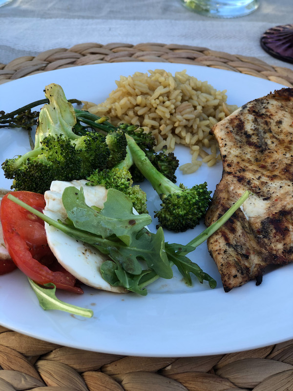 Grilled chicken dinner with grilled broccoli and caprese salad for two! Romantic outdoor dinner for two.