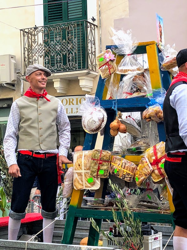 Man standing on float at the Festival Patronale in Casoli, Italy