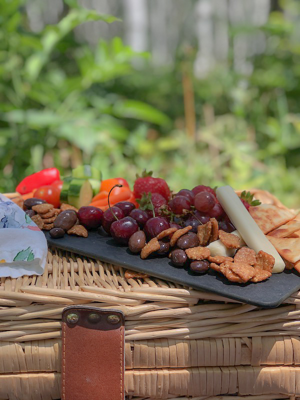 Charcuterie board created for a picnic in the woods