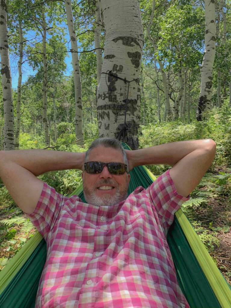 Sitting in the hammock in the woods