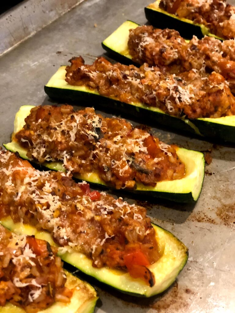 Zucchini turkey boats filled, baked and topped with cheese