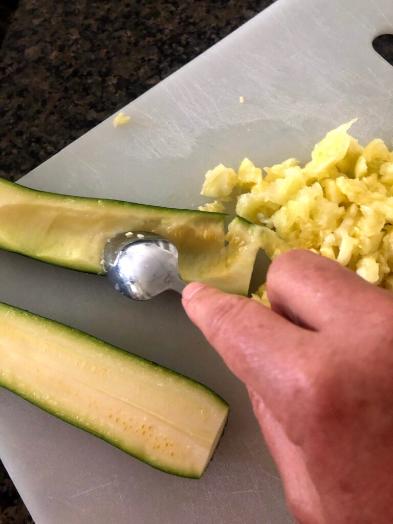 Zucchini turkey boat recipe scooping out the flesh