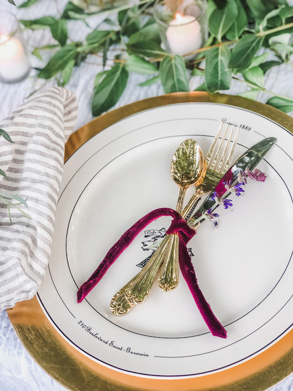 Eiffel tower plates with gold silverware tied with velvet ribbon- Karinskottage.com