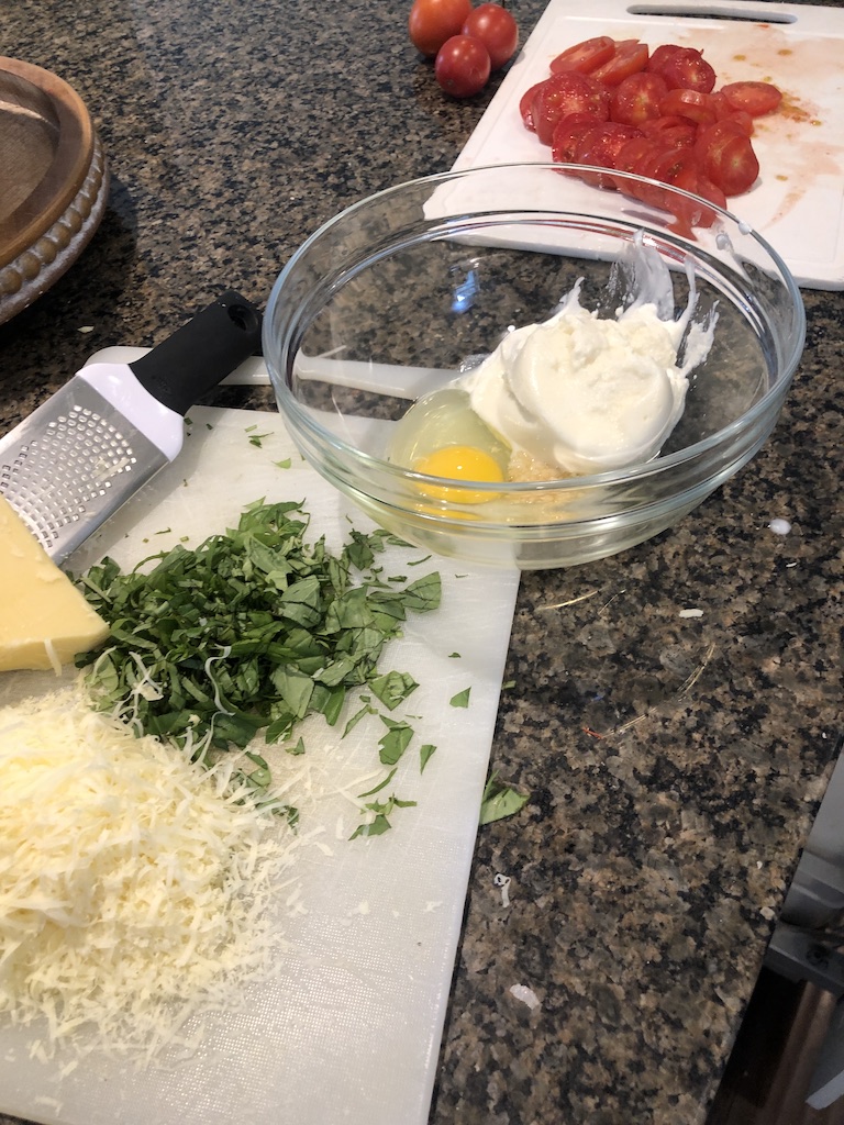 Chopped basil, shredded Gruyère cheese, ricotta cheese, 1 egg, garlic