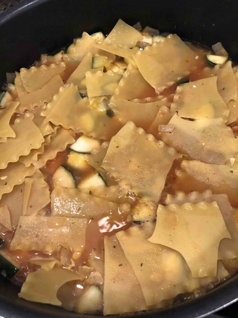 skillet summer lasagna noodles mixed with ricotta cheese and tomatoes