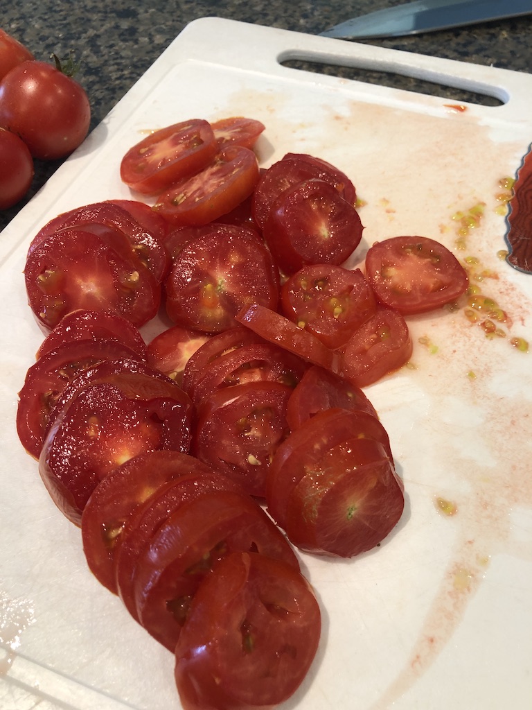 thinly sliced tomatoes