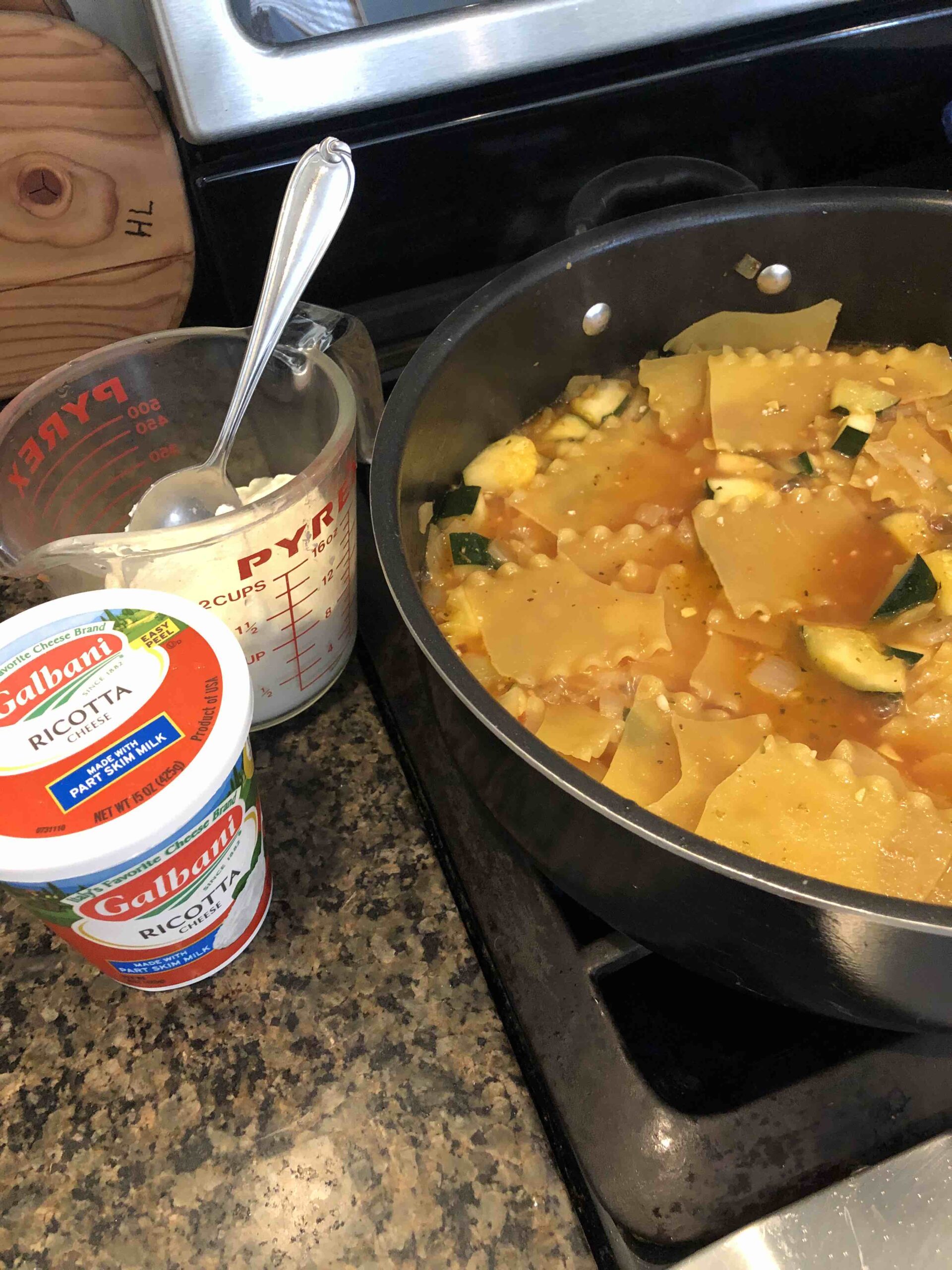 Adding ricotta cheese to skillet summer vegetable lasagna