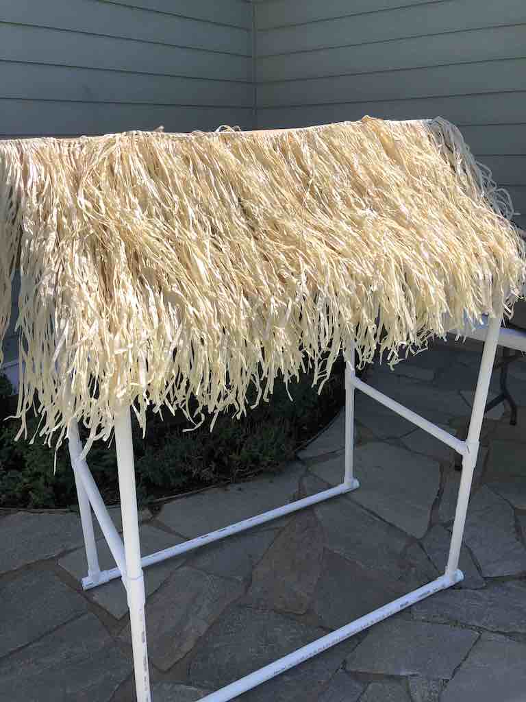 DIY Tiki Bar frame with Grass skirt taped on