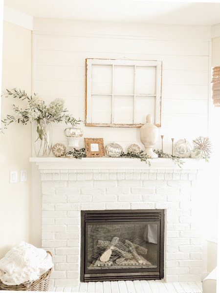 Neutral colored dried hydrangeas for Fall decorated mantle 