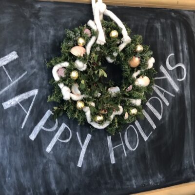 Hanging Coastal Christmas wreath on Chalkboard