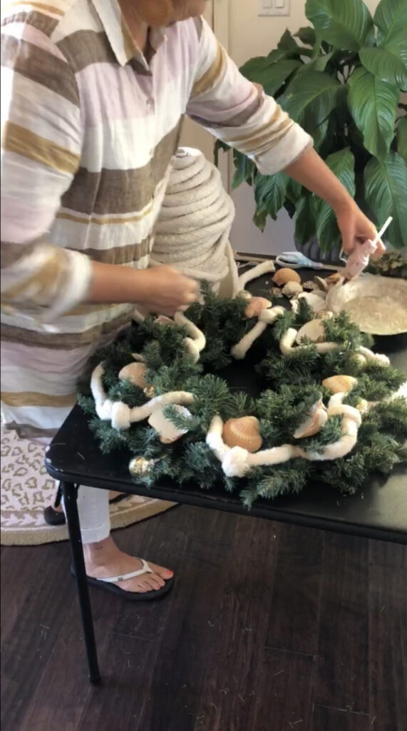 Adding sea shells to Coastal Christmas Wreath