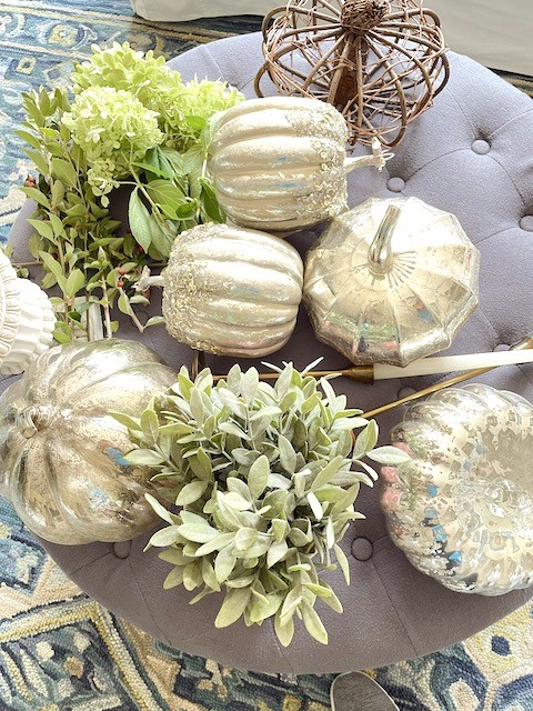 Silver pumpkins and greenery