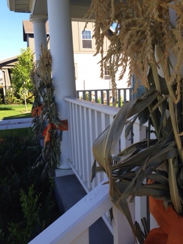 Mulitple corn stalks on porch