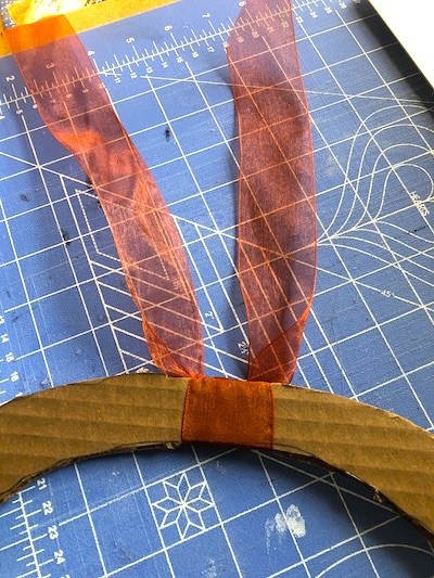 Attach ribbon to cardboard base