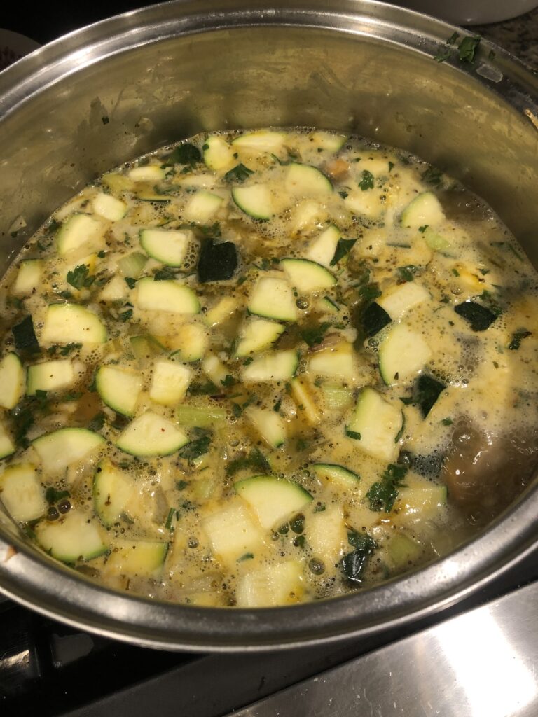 Zucchini Yam soup cooking on stove. 