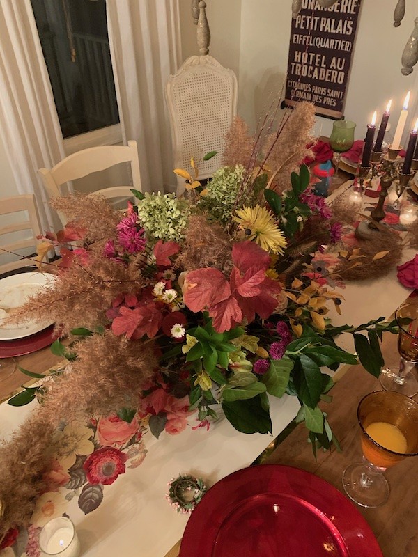How to decorate For a fall dinner party. Use grocery store flowers and add in fall clippings