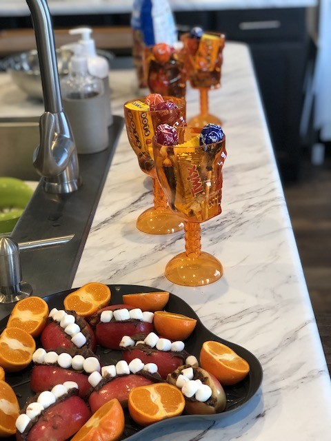 Gold skull goblets filled with candy