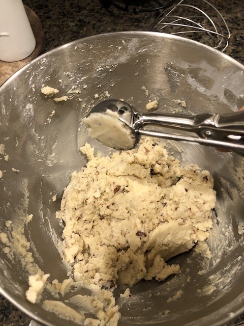 scooping snow ball cookie dough 