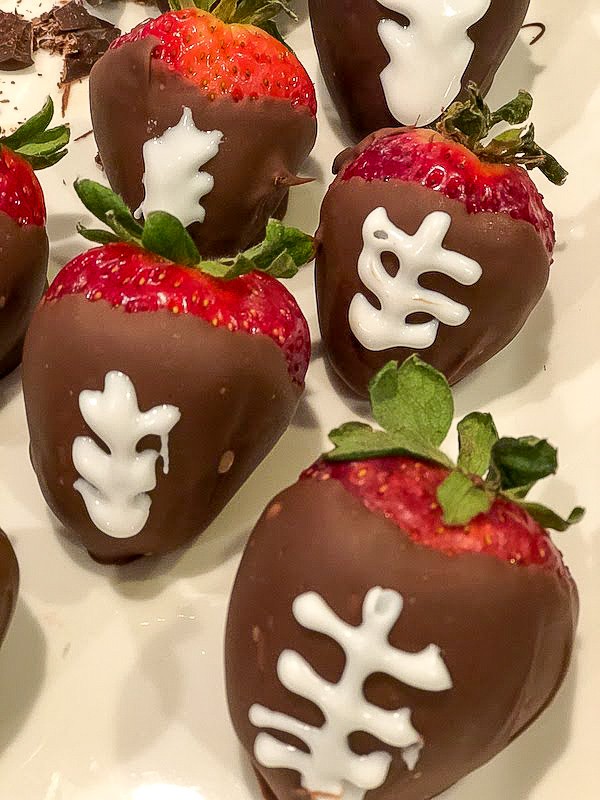Chocolate dipped strawberry footballs
