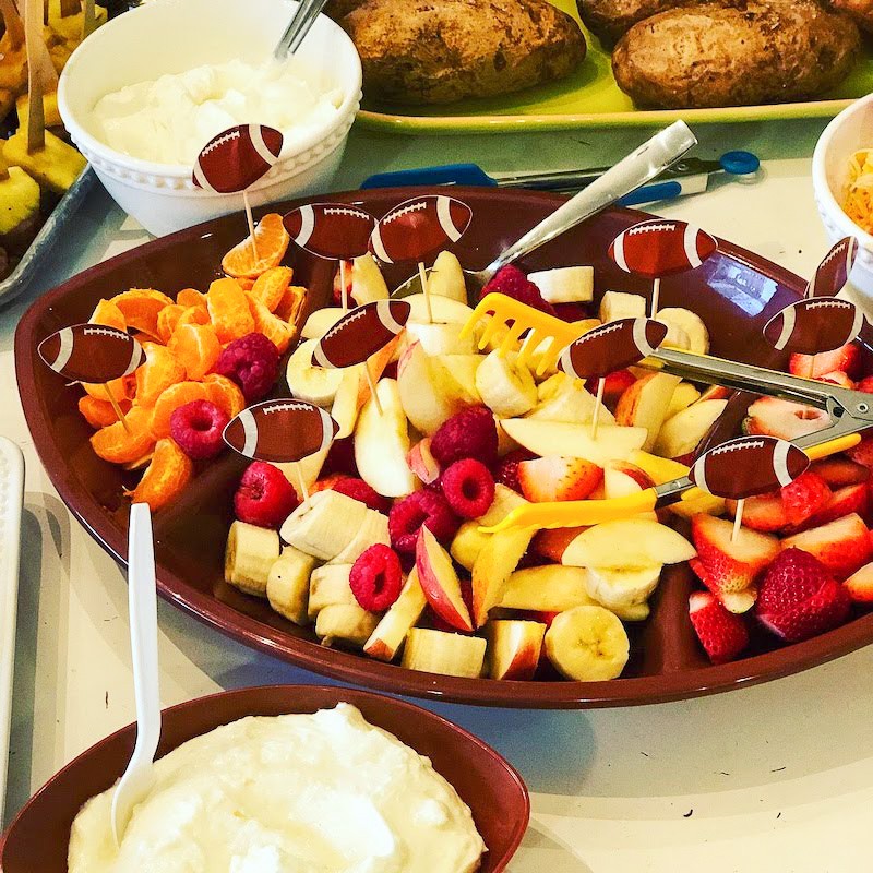Cut up fruit in a football platter easy to make football food