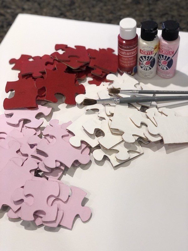 Supplies for puzzle piece heart wreath- red pink and white paint puzzle pieces painted