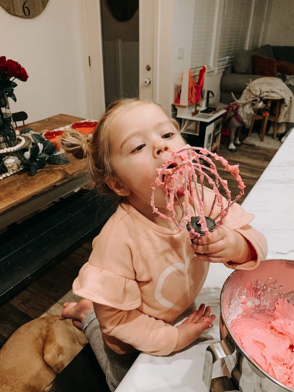 licking the frosting off the beaters