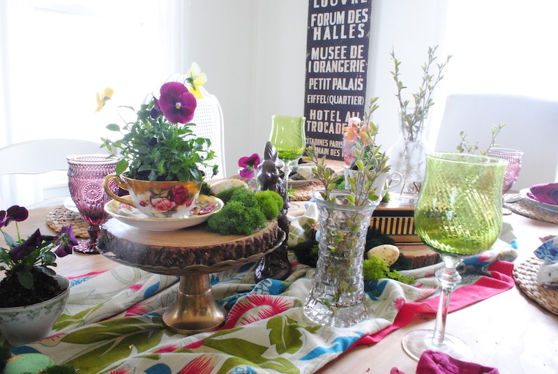 Mini glass vases on colorful vintage Easter table