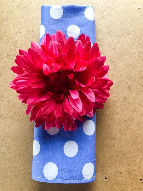 Folded napkin with flower